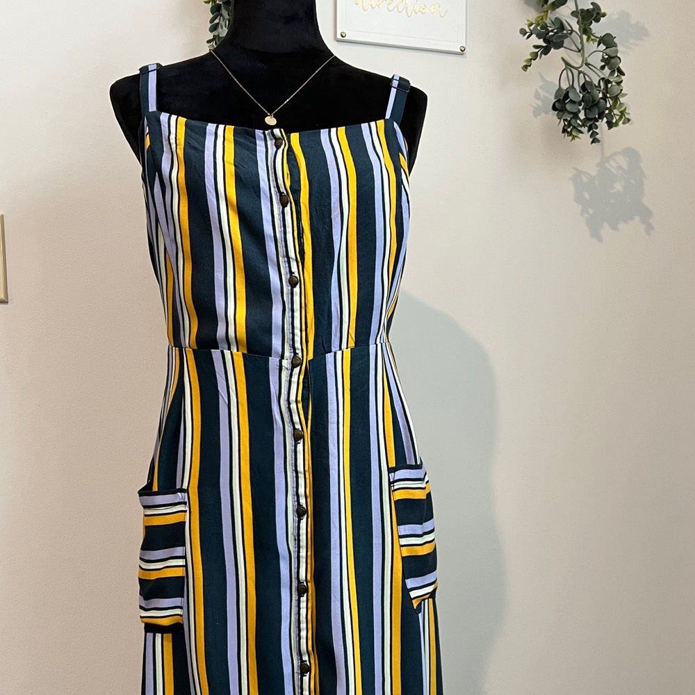 Bright Multi Color Stripe dress with side cutouts and front pockets